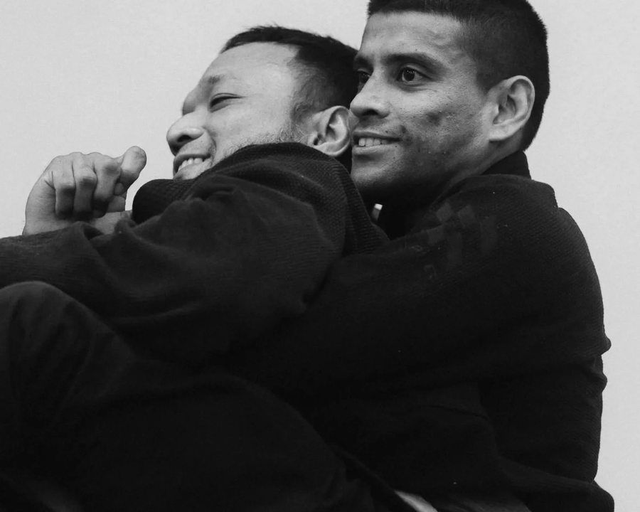 Students training jiu-jitsu