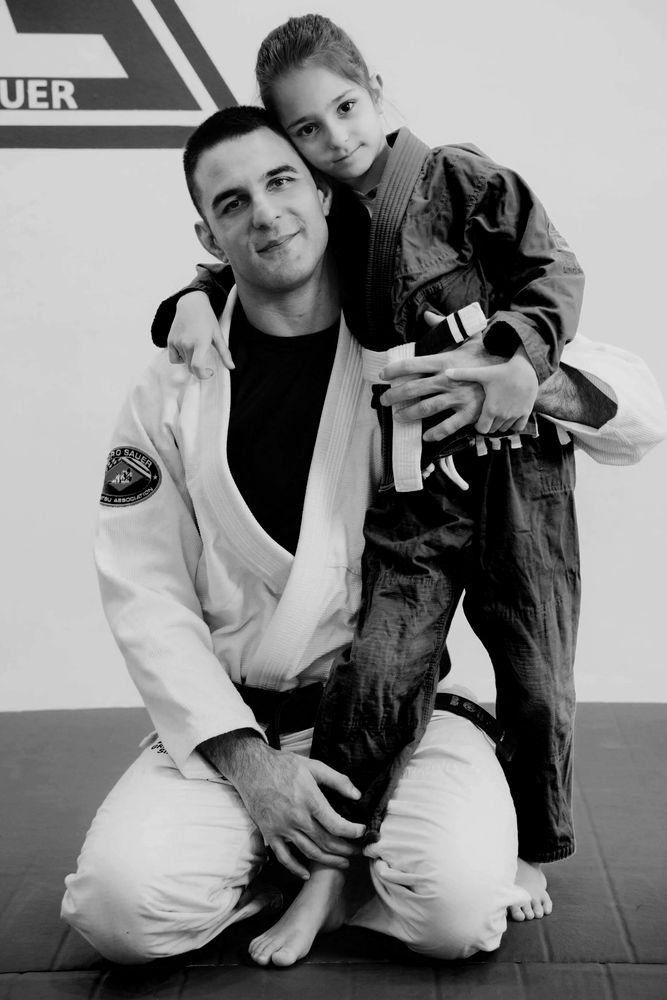Instructor with a young child at the Kids class